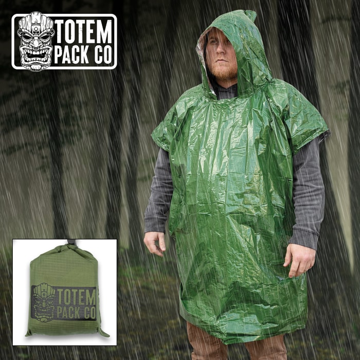 Full image of the green Totem Pack Co. Camping Rain Poncho being worn by a person.